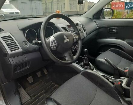 Синий Мицубиси Аутлендер, объемом двигателя 2 л и пробегом 200 тыс. км за 10500 $, фото 20 на Automoto.ua