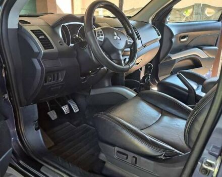 Синий Мицубиси Аутлендер, объемом двигателя 2.18 л и пробегом 205 тыс. км за 11000 $, фото 4 на Automoto.ua