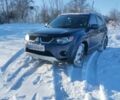 Синий Мицубиси Аутлендер, объемом двигателя 2.4 л и пробегом 293 тыс. км за 9200 $, фото 1 на Automoto.ua