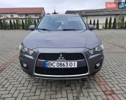 Синий Мицубиси Аутлендер, объемом двигателя 2 л и пробегом 200 тыс. км за 10500 $, фото 2 на Automoto.ua
