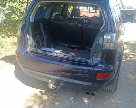 Синий Мицубиси Аутлендер, объемом двигателя 2.18 л и пробегом 223 тыс. км за 11200 $, фото 5 на Automoto.ua