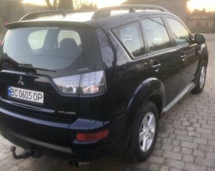 Синий Мицубиси Аутлендер, объемом двигателя 2 л и пробегом 235 тыс. км за 8800 $, фото 1 на Automoto.ua