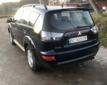 Синий Мицубиси Аутлендер, объемом двигателя 2 л и пробегом 235 тыс. км за 8800 $, фото 3 на Automoto.ua