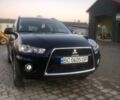 Синий Мицубиси Аутлендер, объемом двигателя 2 л и пробегом 235 тыс. км за 8800 $, фото 1 на Automoto.ua