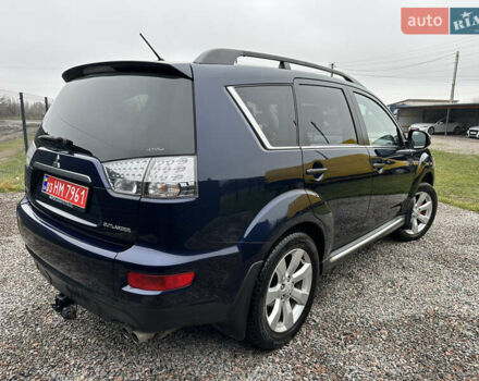 Синий Мицубиси Аутлендер, объемом двигателя 2.3 л и пробегом 202 тыс. км за 11650 $, фото 7 на Automoto.ua