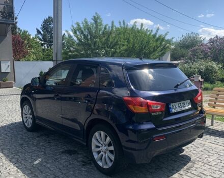 Синий Мицубиси Аутлендер, объемом двигателя 2 л и пробегом 185 тыс. км за 9000 $, фото 3 на Automoto.ua