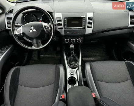 Синий Мицубиси Аутлендер, объемом двигателя 2.3 л и пробегом 202 тыс. км за 11650 $, фото 13 на Automoto.ua