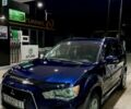 Синий Мицубиси Аутлендер, объемом двигателя 2.27 л и пробегом 262 тыс. км за 12000 $, фото 1 на Automoto.ua