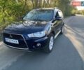 Синий Мицубиси Аутлендер, объемом двигателя 2.18 л и пробегом 220 тыс. км за 12500 $, фото 1 на Automoto.ua