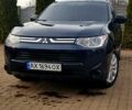 Синий Мицубиси Аутлендер, объемом двигателя 2.4 л и пробегом 256 тыс. км за 12400 $, фото 1 на Automoto.ua