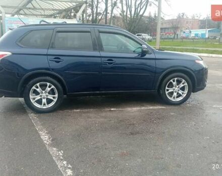 Синий Мицубиси Аутлендер, объемом двигателя 2.4 л и пробегом 230 тыс. км за 11300 $, фото 1 на Automoto.ua