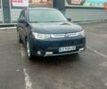 Синий Мицубиси Аутлендер, объемом двигателя 2.4 л и пробегом 230 тыс. км за 11300 $, фото 1 на Automoto.ua