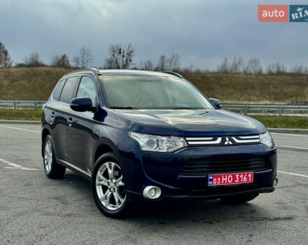 Синий Мицубиси Аутлендер, объемом двигателя 2 л и пробегом 218 тыс. км за 12550 $, фото 1 на Automoto.ua
