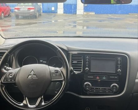 Синий Мицубиси Аутлендер, объемом двигателя 2.4 л и пробегом 202 тыс. км за 14300 $, фото 3 на Automoto.ua