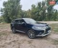 Синий Мицубиси Аутлендер, объемом двигателя 2.36 л и пробегом 135 тыс. км за 15600 $, фото 1 на Automoto.ua