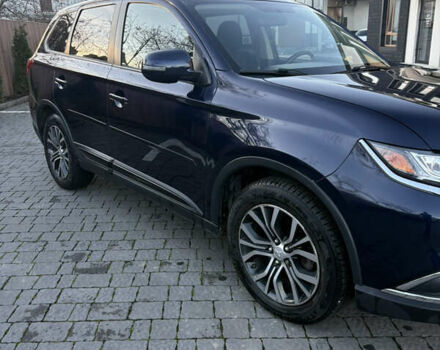 Синий Мицубиси Аутлендер, объемом двигателя 2.38 л и пробегом 99 тыс. км за 15400 $, фото 7 на Automoto.ua