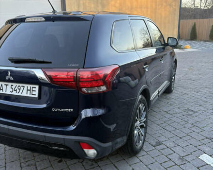 Синий Мицубиси Аутлендер, объемом двигателя 2.38 л и пробегом 99 тыс. км за 15400 $, фото 6 на Automoto.ua