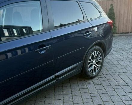 Синий Мицубиси Аутлендер, объемом двигателя 2.38 л и пробегом 99 тыс. км за 15400 $, фото 2 на Automoto.ua