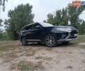 Синий Мицубиси Аутлендер, объемом двигателя 2.36 л и пробегом 135 тыс. км за 15600 $, фото 1 на Automoto.ua