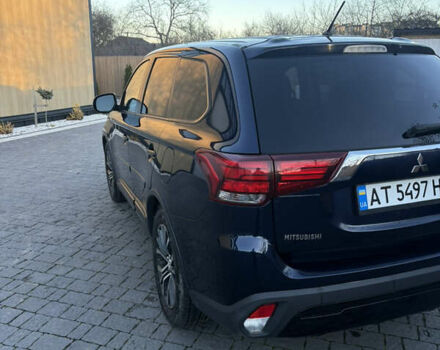 Синий Мицубиси Аутлендер, объемом двигателя 2.38 л и пробегом 99 тыс. км за 15400 $, фото 3 на Automoto.ua