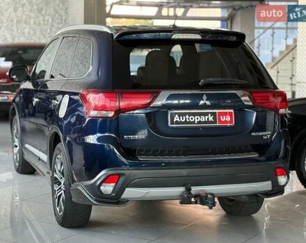Синий Мицубиси Аутлендер, объемом двигателя 3 л и пробегом 144 тыс. км за 15940 $, фото 5 на Automoto.ua