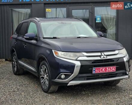 Синий Мицубиси Аутлендер, объемом двигателя 2.4 л и пробегом 134 тыс. км за 13999 $, фото 1 на Automoto.ua