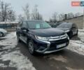 Синий Мицубиси Аутлендер, объемом двигателя 2.36 л и пробегом 195 тыс. км за 13450 $, фото 1 на Automoto.ua