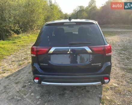Синий Мицубиси Аутлендер, объемом двигателя 2.4 л и пробегом 221 тыс. км за 12300 $, фото 2 на Automoto.ua