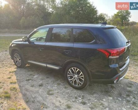 Синий Мицубиси Аутлендер, объемом двигателя 2.4 л и пробегом 221 тыс. км за 12300 $, фото 7 на Automoto.ua