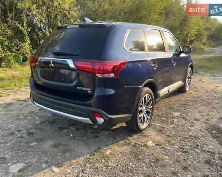Синий Мицубиси Аутлендер, объемом двигателя 2.4 л и пробегом 221 тыс. км за 12300 $, фото 6 на Automoto.ua