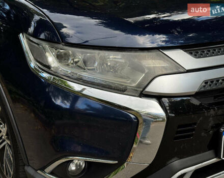 Синий Мицубиси Аутлендер, объемом двигателя 2.4 л и пробегом 144 тыс. км за 15490 $, фото 1 на Automoto.ua