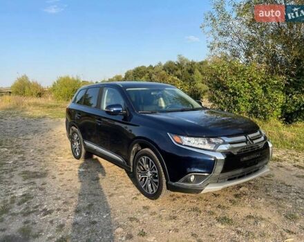 Синий Мицубиси Аутлендер, объемом двигателя 2.4 л и пробегом 221 тыс. км за 12300 $, фото 3 на Automoto.ua