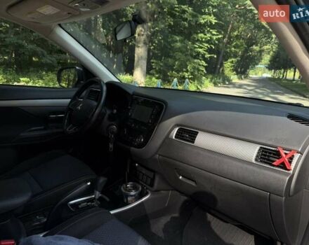 Синий Мицубиси Аутлендер, объемом двигателя 2.4 л и пробегом 102 тыс. км за 15000 $, фото 4 на Automoto.ua