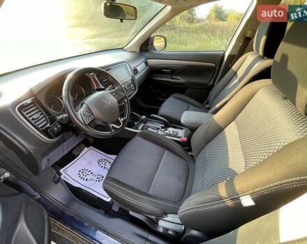 Синий Мицубиси Аутлендер, объемом двигателя 2.4 л и пробегом 221 тыс. км за 12300 $, фото 1 на Automoto.ua