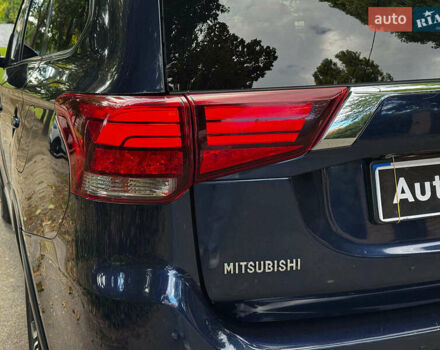Синий Мицубиси Аутлендер, объемом двигателя 2.4 л и пробегом 144 тыс. км за 15490 $, фото 5 на Automoto.ua