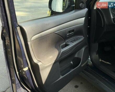 Синий Мицубиси Аутлендер, объемом двигателя 2.4 л и пробегом 102 тыс. км за 15000 $, фото 10 на Automoto.ua