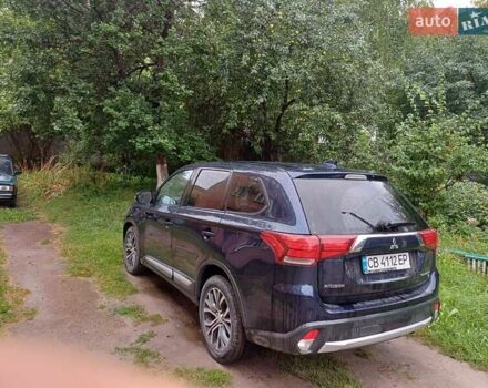 Синий Мицубиси Аутлендер, объемом двигателя 2.42 л и пробегом 135 тыс. км за 17000 $, фото 1 на Automoto.ua