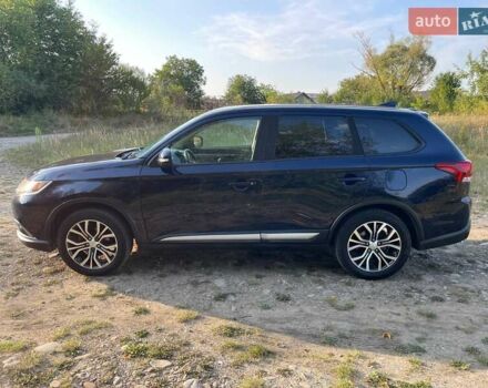 Синий Мицубиси Аутлендер, объемом двигателя 2.4 л и пробегом 221 тыс. км за 12300 $, фото 4 на Automoto.ua