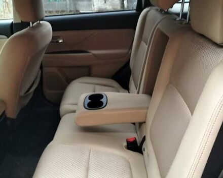 Синий Мицубиси Аутлендер, объемом двигателя 2.42 л и пробегом 135 тыс. км за 17000 $, фото 4 на Automoto.ua