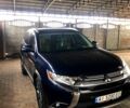 Синий Мицубиси Аутлендер, объемом двигателя 2.4 л и пробегом 127 тыс. км за 14500 $, фото 1 на Automoto.ua