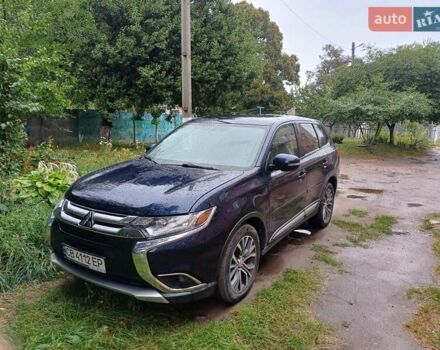 Синий Мицубиси Аутлендер, объемом двигателя 2.42 л и пробегом 135 тыс. км за 17000 $, фото 2 на Automoto.ua