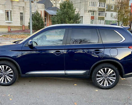 Синий Мицубиси Аутлендер, объемом двигателя 2.36 л и пробегом 71 тыс. км за 13800 $, фото 3 на Automoto.ua