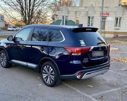 Синий Мицубиси Аутлендер, объемом двигателя 2.4 л и пробегом 71 тыс. км за 11800 $, фото 3 на Automoto.ua