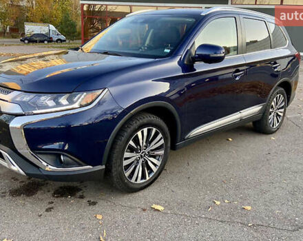 Синий Мицубиси Аутлендер, объемом двигателя 2.36 л и пробегом 71 тыс. км за 13800 $, фото 2 на Automoto.ua