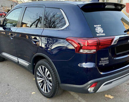 Синий Мицубиси Аутлендер, объемом двигателя 2.36 л и пробегом 71 тыс. км за 13800 $, фото 4 на Automoto.ua