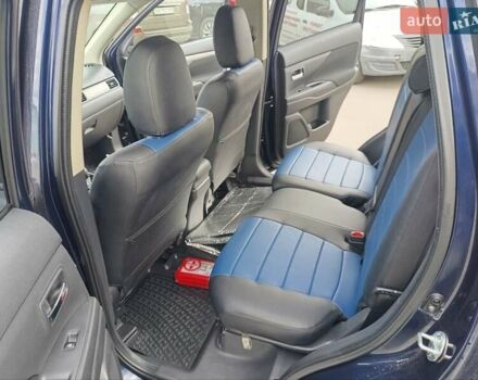 Синий Мицубиси Аутлендер, объемом двигателя 2.4 л и пробегом 134 тыс. км за 15200 $, фото 7 на Automoto.ua