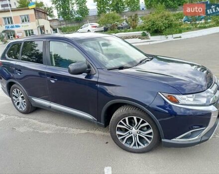 Синий Мицубиси Аутлендер, объемом двигателя 2.4 л и пробегом 134 тыс. км за 15200 $, фото 1 на Automoto.ua