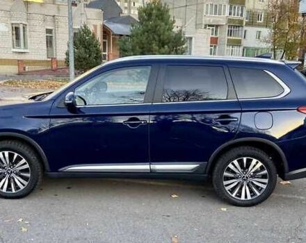 Синий Мицубиси Аутлендер, объемом двигателя 2.4 л и пробегом 71 тыс. км за 11800 $, фото 2 на Automoto.ua