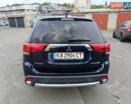 Синий Мицубиси Аутлендер, объемом двигателя 2.4 л и пробегом 134 тыс. км за 15200 $, фото 3 на Automoto.ua