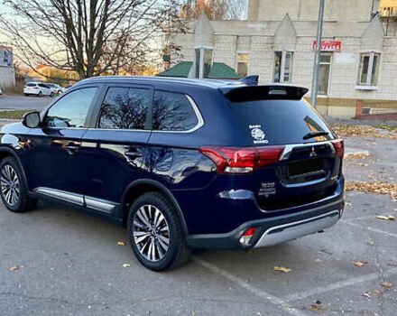 Синий Мицубиси Аутлендер, объемом двигателя 2.36 л и пробегом 71 тыс. км за 13800 $, фото 5 на Automoto.ua
